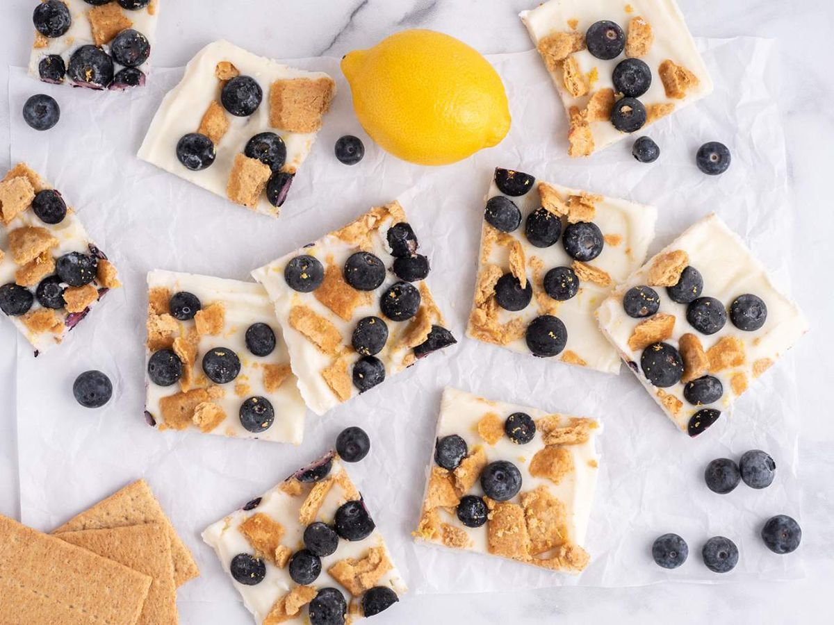Healthy Dessert Recipes Blueberry Lemon Frozen Yogurt Bark with Graham Crackers on a White Board