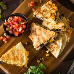 Healthy chicken quesadillas with pico de gallo on the side.